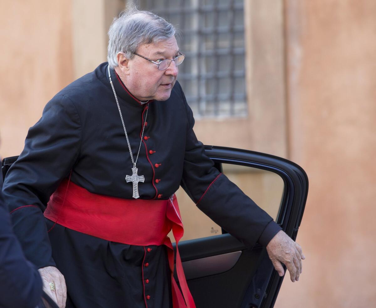 Cardinal George Pell arrives for a session at the Vatican in October of last year.