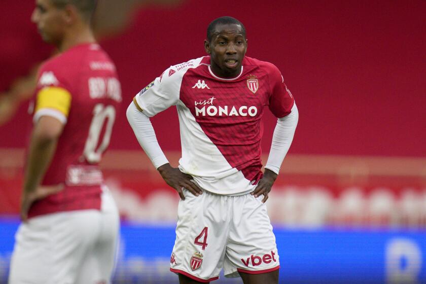 FILE - Monaco's Mohamed Camara reacts during the French League One soccer match between AS Monaco and FC Metz, at the Stade Louis II in Monaco, Sunday, Oct. 22, 2023. French Sports Minister Amélie Oudéa-Castéra calls for sanctions against AS Monaco's Mohamed Camara after he covers the anti-homophobia logo on his jersey during the final Ligue 1 game Sunday. This incident marks the fourth consecutive year of controversy over the league's anti- discrimination efforts involving rainbow-colored symbols on jerseys. (AP Photo/Daniel Cole, File)