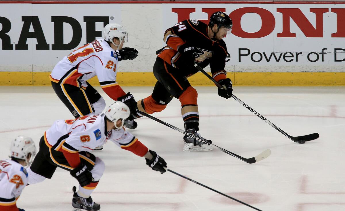 Ducks defenseman Simon Despres gets off a shot against the Flames in the second period of Game 2.