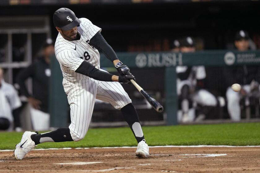 Chicago White Sox's Tommy Pham hits an RBI single off Cleveland Guardians pitcher Ben Lively during the second inning of a baseball game Thursday, May 9, 2024, in Chicago. (AP Photo/Charles Rex Arbogast)