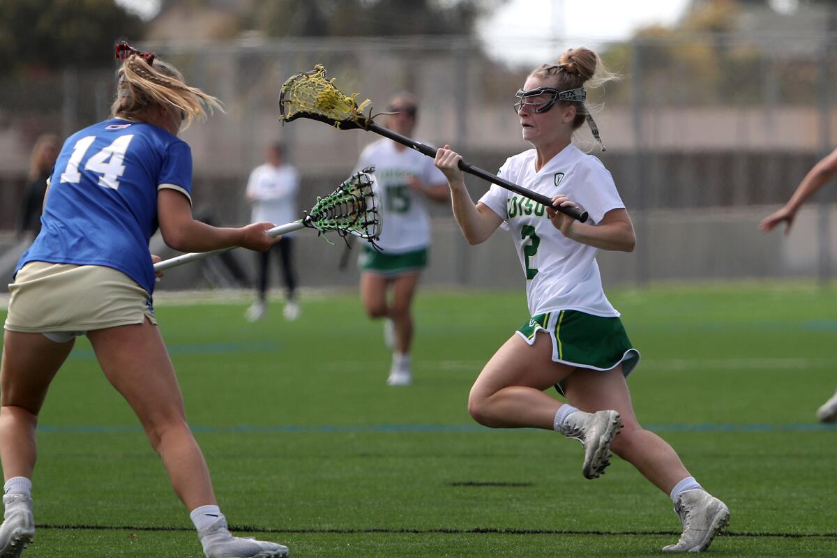 Edison's Blakely Malpass, right, competes against Santa Margarita's Brooke Cressy.