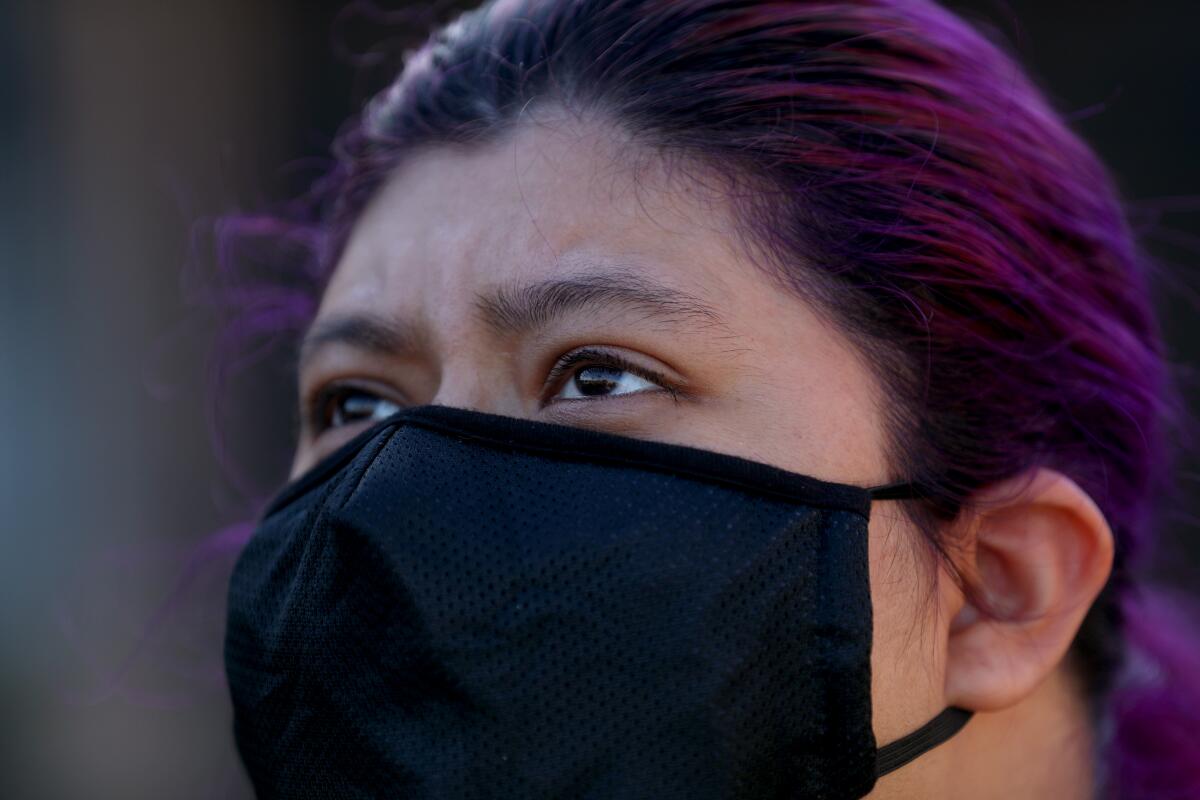 20-year-old Priscilla Zubia wears a mask