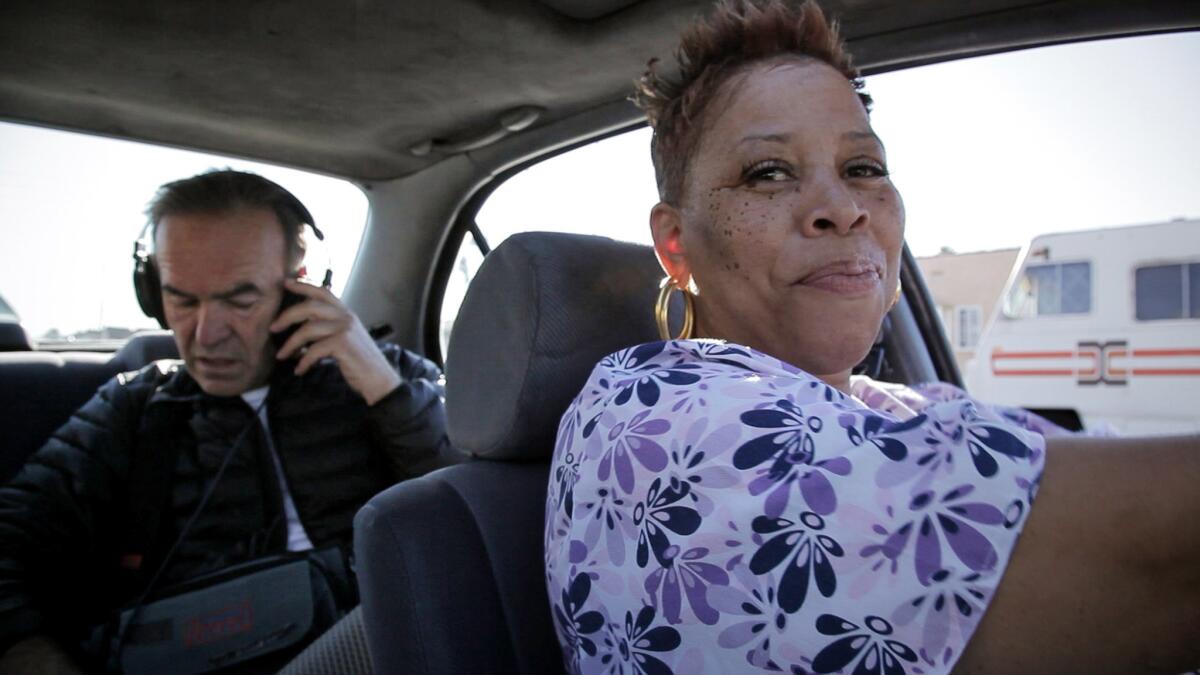 Pam Brooks, front, plays the guide in the film. Director Nick Broomfield is pictured the back seat.