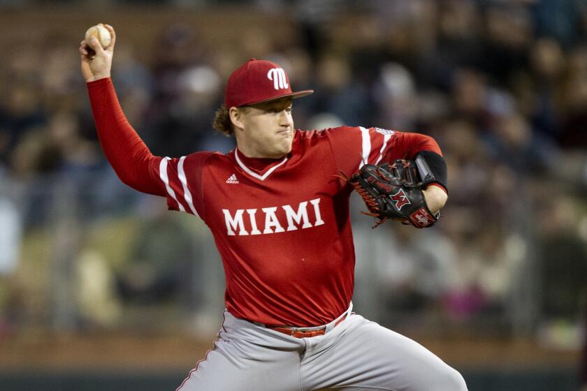 Miami (Oh) Sam Bachman (18) throws. Astride against Texas A&M during an NCAA baseball game on Friday, Feb. 14, 2020, in College Station, Texas. (AP Photo/Sam Craft)