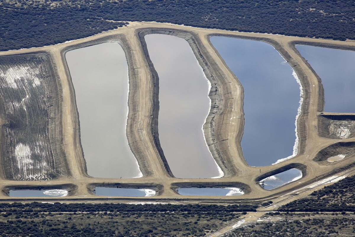 An aerial view of pits containing production water from oil wells near California 33 and Lokern Road in Kern County.