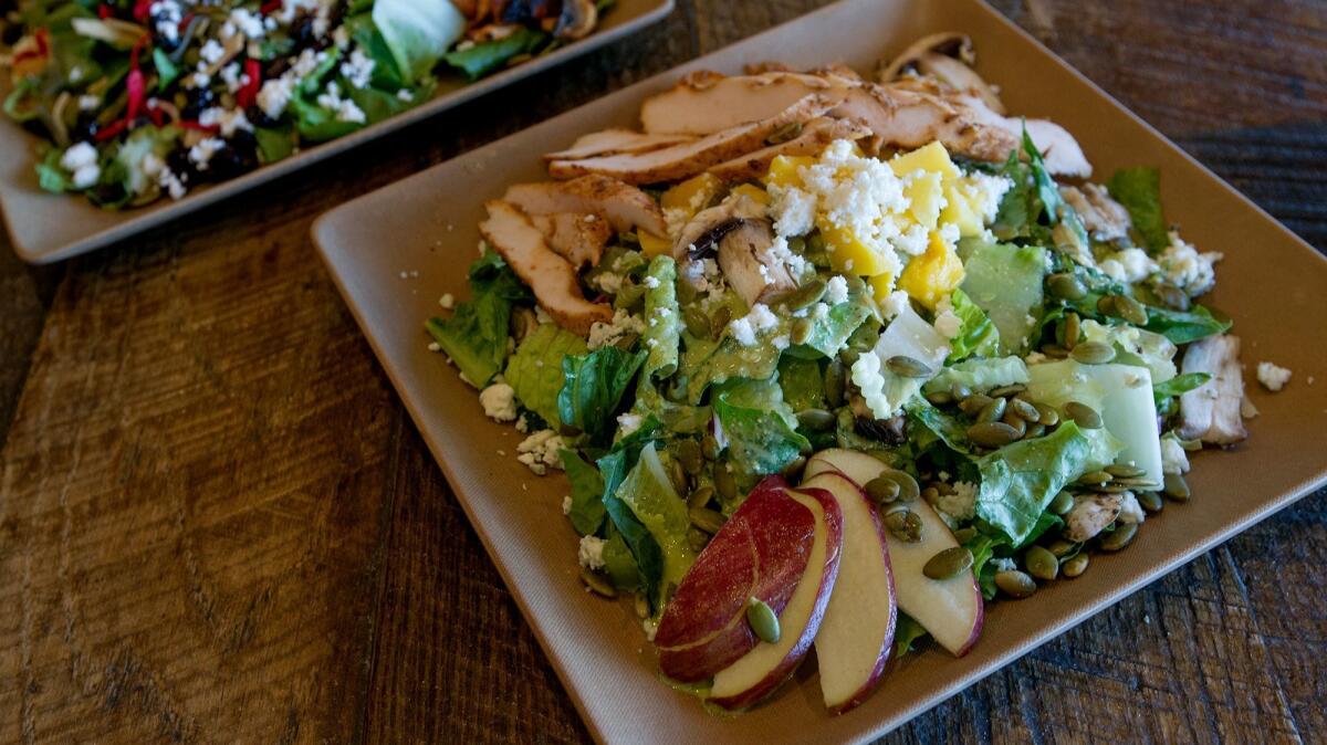 The "Blue Moon" salad, right, and "Hacienda Black Bean" salad at Caliente in Costa Mesa.