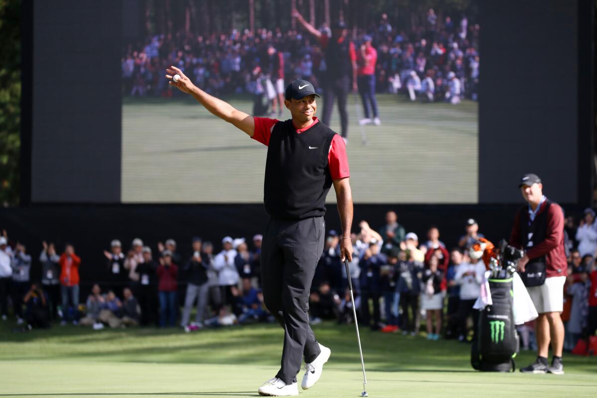 Tiger Woods celebrates after winning the Zozo Championship in Japan on Monday.