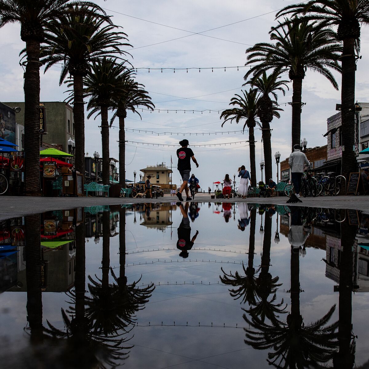 A rain puddle on a sidewalk in Huntington Beach.