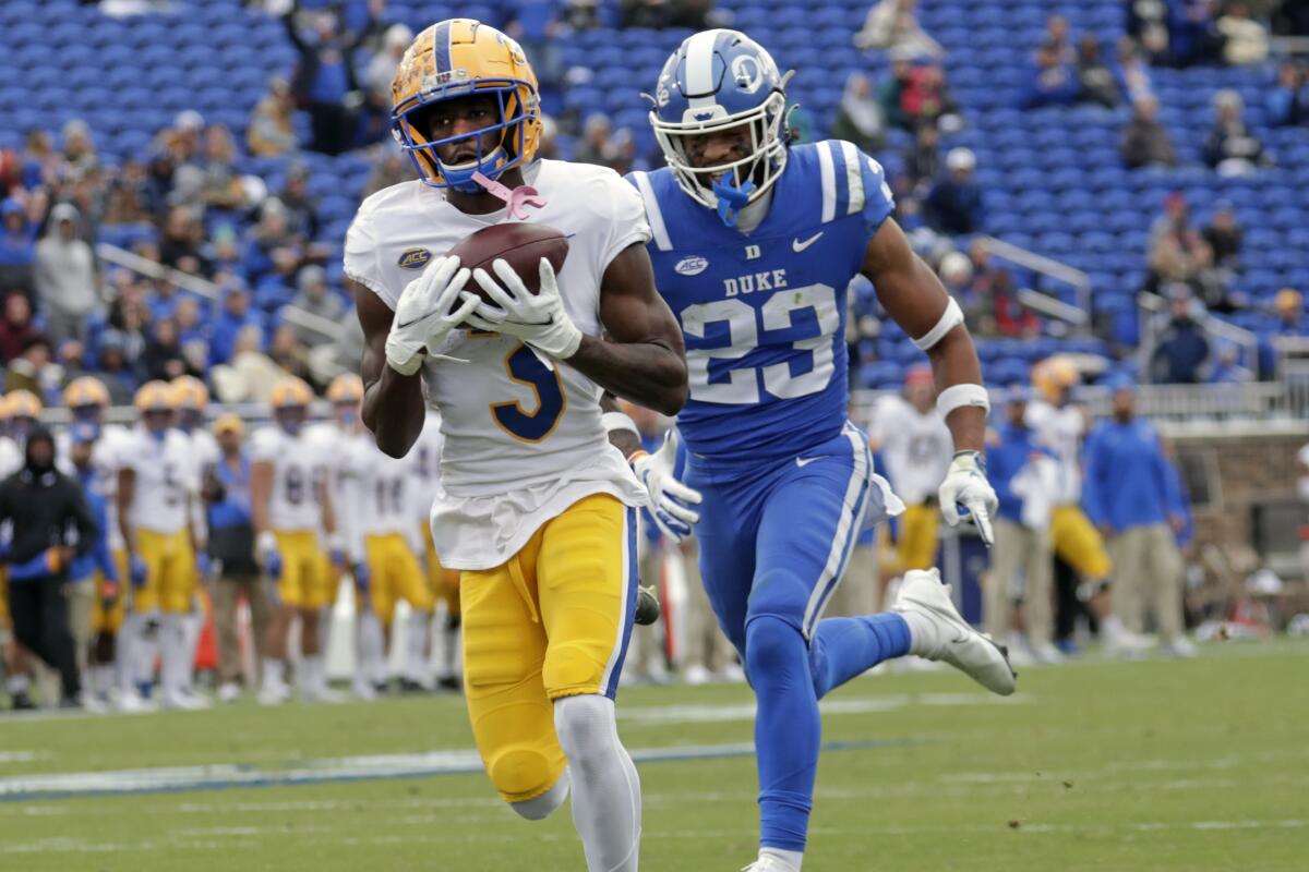 Pittsburgh wide receiver Jordan Addison (3) hauls in a pass for a touchdown against Duke safety Lummie Young IV (23) during the first half of an NCAA college football game Saturday, Nov. 6, 2021, in Durham, N.C. (AP Photo/Chris Seward)