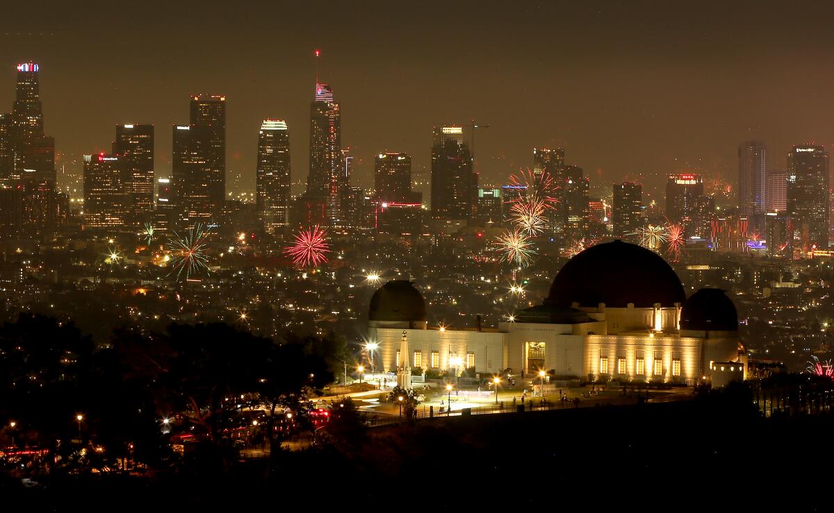 Illegal fireworks explode over downtown Los Angeles on the Fourth of July.