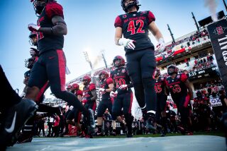San Diego, CA - November 05: San Diego State players run onto the field before the Aztecs' game against UNLV at Snapdragon Stadium on Saturday, Nov. 5, 2022 in San Diego, CA. (Meg McLaughlin / The San Diego Union-Tribune)