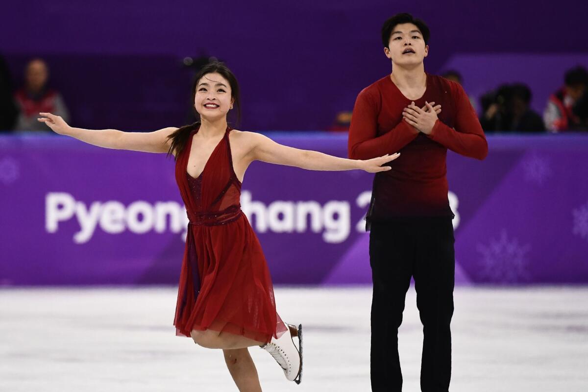 American siblings Maia and Alex Shibutani react after competing in the ice dance free dance.