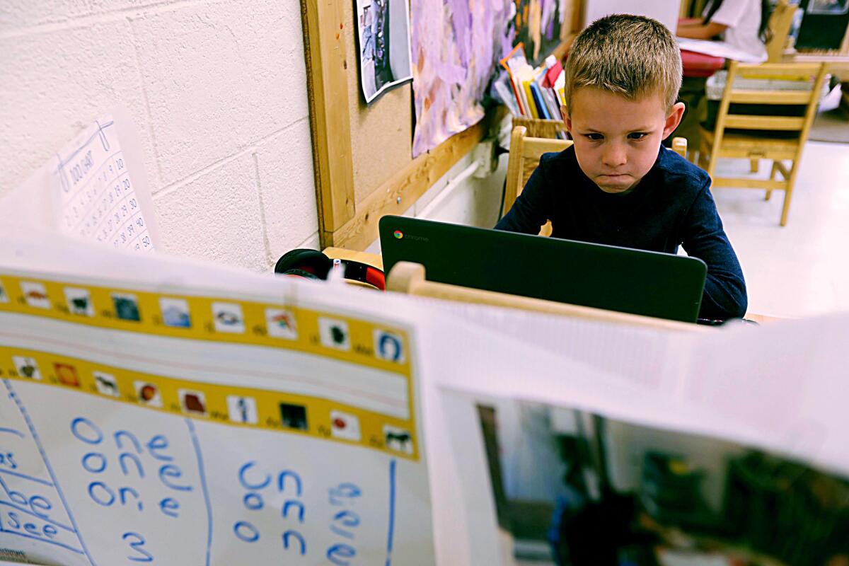 Kindergarten student Bobby, 6, works on his computer while attending class at a preschool in Santa Monica in February.