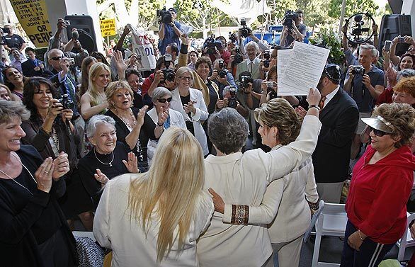 A crowd gathers in front of the Beverly Hills courthouse, where Tyler and Olson held their wedding ceremony. For eight years the couple showed up at the courthouse each Valentines Day and were repeatedly denied a marriage license.