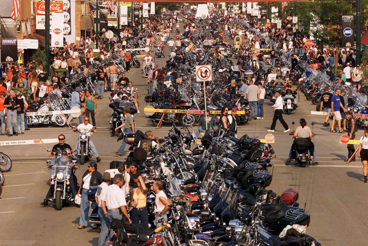 Harley-Davidson and the South Dakota town of Sturgis, seen here crowded with attendees at its annual Sturgis Motorcycle Rally, have inked a 75-year deal to make Harleys the town's official motorcycle.