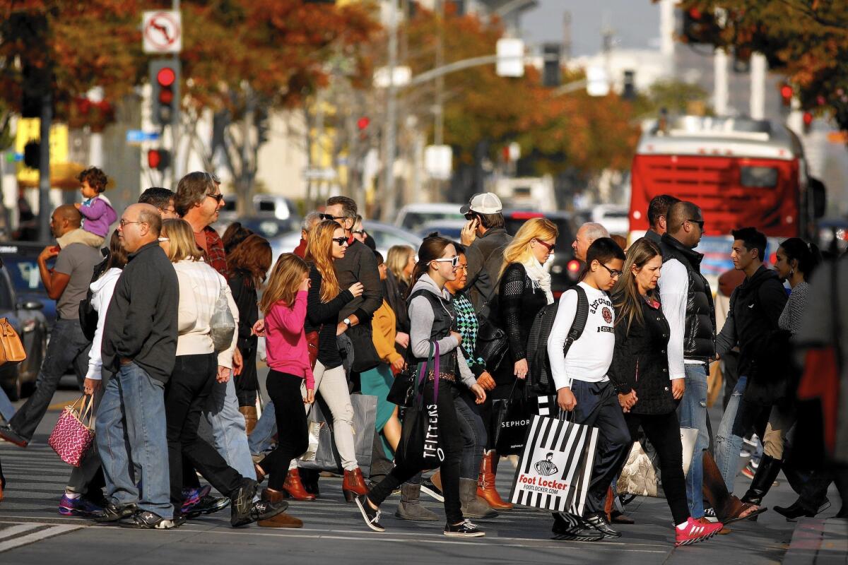 Shoppers brave the Third Street Promenade in Santa Monica on the last Saturday before Christmas, known as Super Saturday, in 2013.