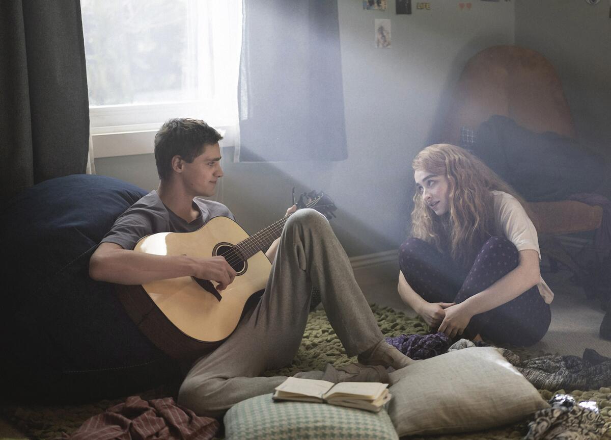 Fin Argus' teen musician talks with his songwriting partner, played by Sabrina Carpenter, in the movie "Clouds."