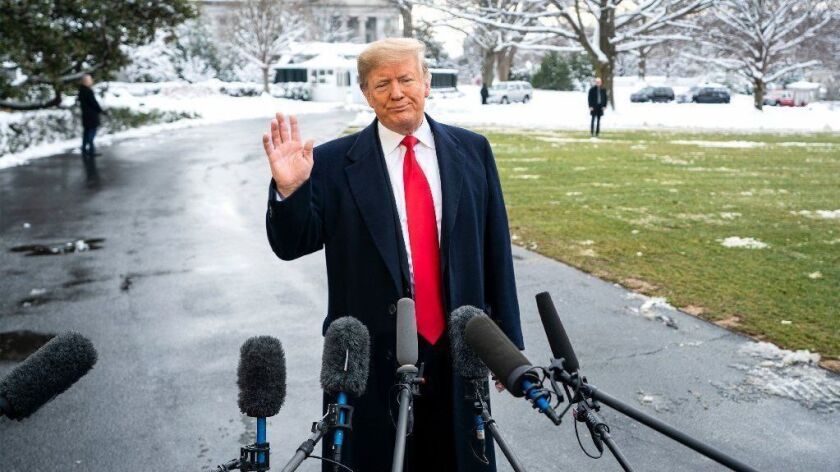 President Trump speaks to members of the media outside the White House on Jan. 14.