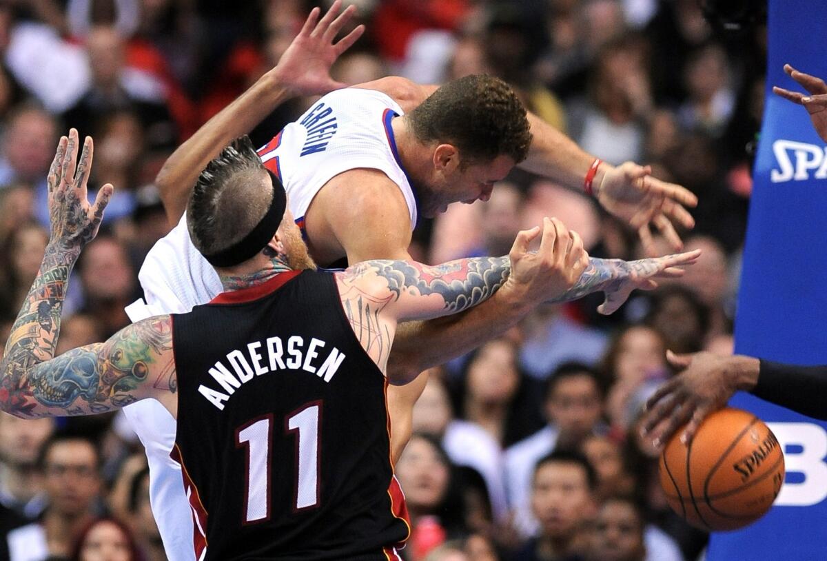 Blake Griffin is fouled by Miami's Chris Anderson during the Clippers' 116-112 loss Wednesday to the Heat. Griffin was on the floor for more than 40 minutes and recorded a career-high 43 points in the loss.