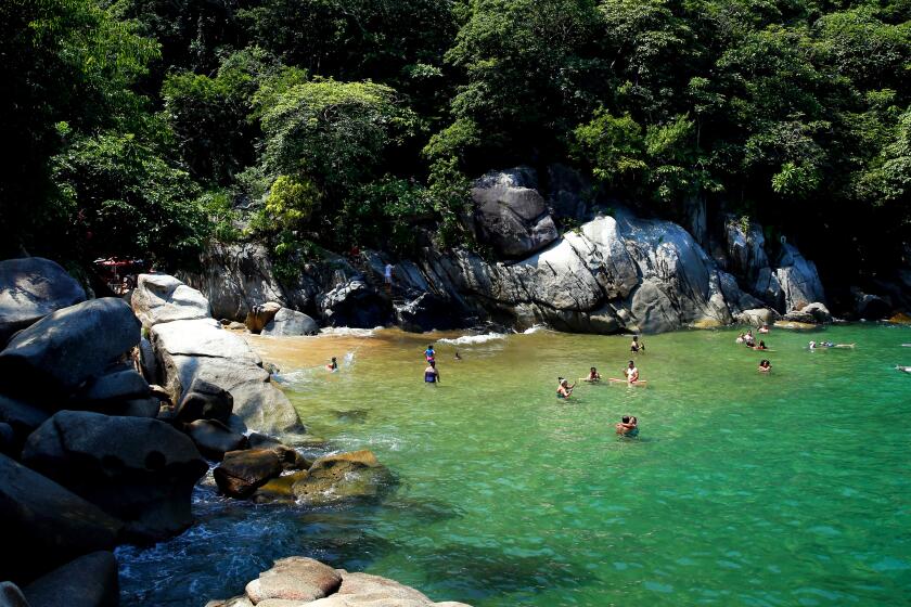 PUERTO VALLARTA, MEX-AUGUST 31, 2019: People take a dip at Colomitos Cove on August 31, 2019 in Puerto Vallarta, Mexico. The hike to Colomitos Cove from Boca de Tomatlan is about 45 minutes. (Photo By Dania Maxwell / Los Angeles Times)