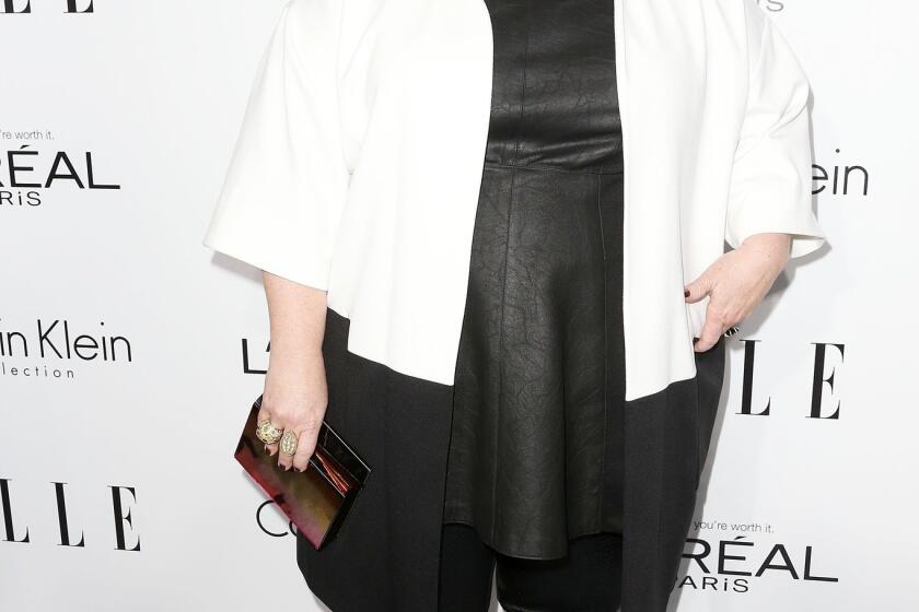 Actress Melissa McCarthy wore a Calvin Klein layered ensemble composed of a white and black jacket over a black leather tunic and fitted pants to Elle's 20th annual Women in Hollywood Celebration. Her outfit was edgy and anything but shapeless.