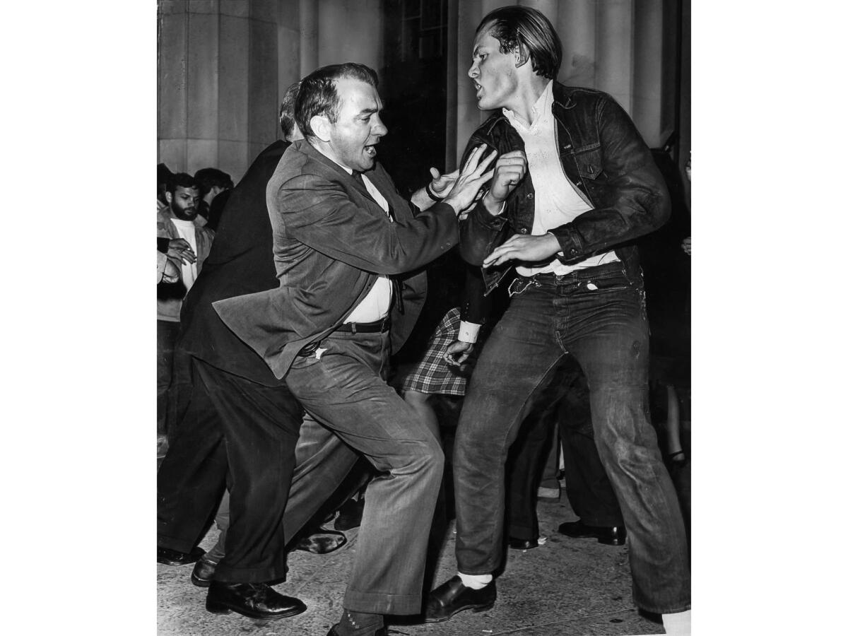 March 9, 1965: A deputy U.S. marshal, left, struggles with a civil rights demonstrator during a melee that erupted at the Federal Building when the protesters attemped to stage a sit-in there.
