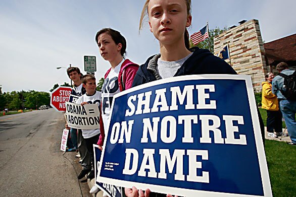 Antiabortion activists line the streets near the campus of Notre Dame University in South Bend, Ind., where President Obama received an honorary degree and gave a commencement speech.