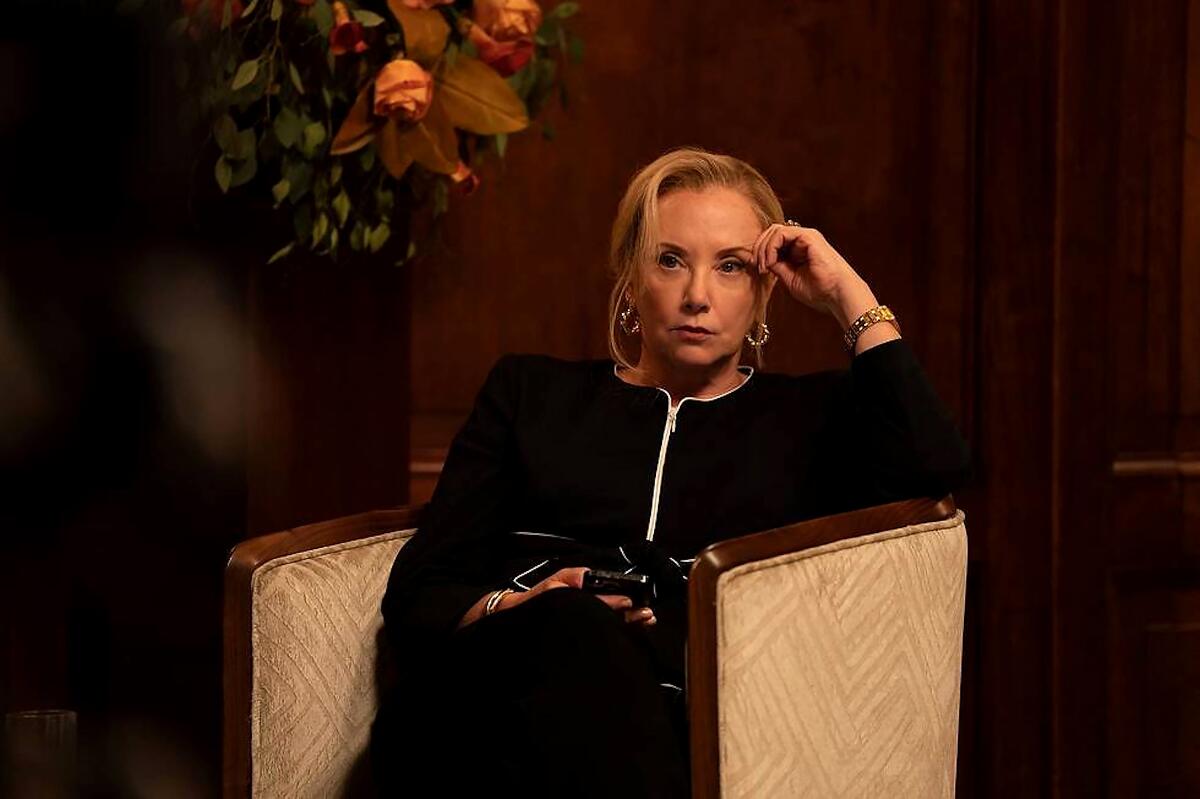 A woman dressed in black looks intense in a scene from "Succession."