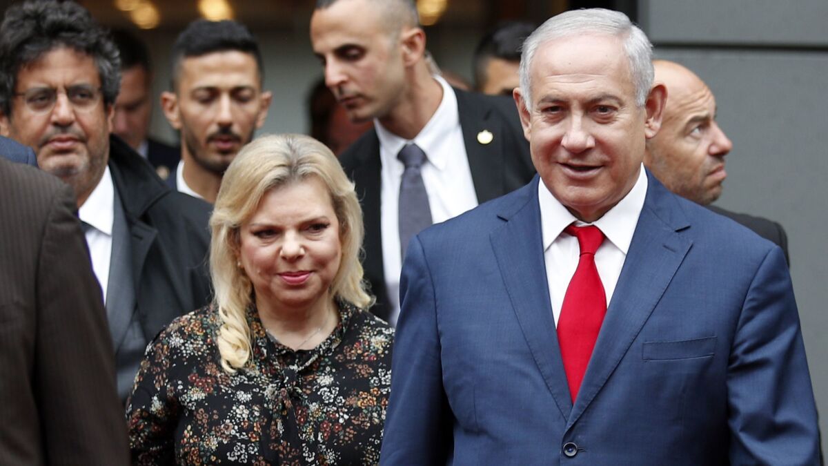 Israeli Prime Minister Benjamin Netanyahu and his wife, Sara Netanyahu, leave a meeting in Paris on June 6.