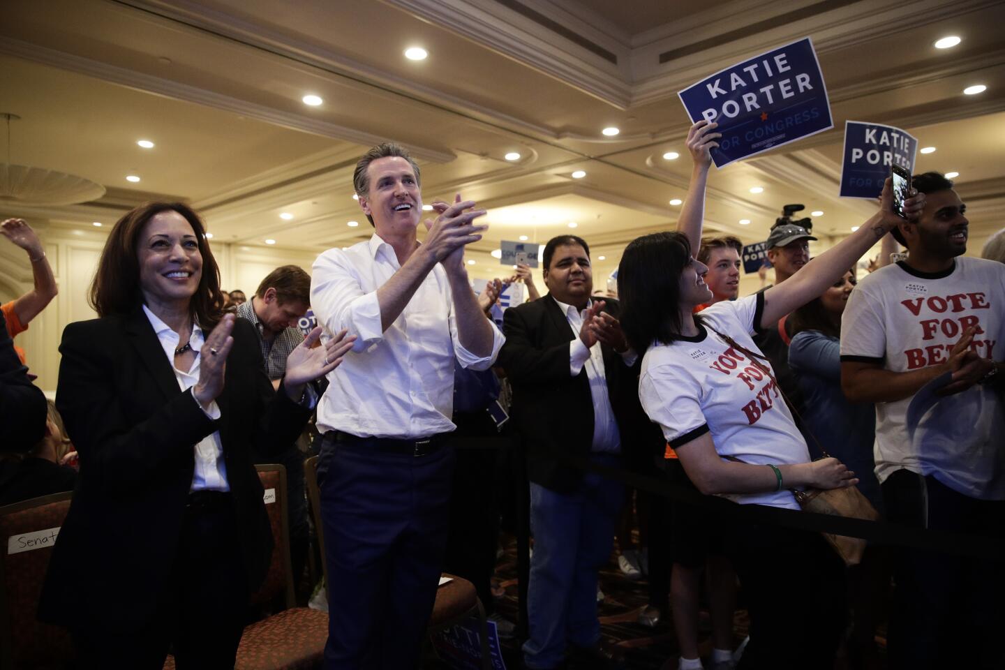 Nov. 3, 2018: Sen. Kamala Harris, D-Calif., left, and California gubernatorial Democratic candidate Gavin Newsom applaud.