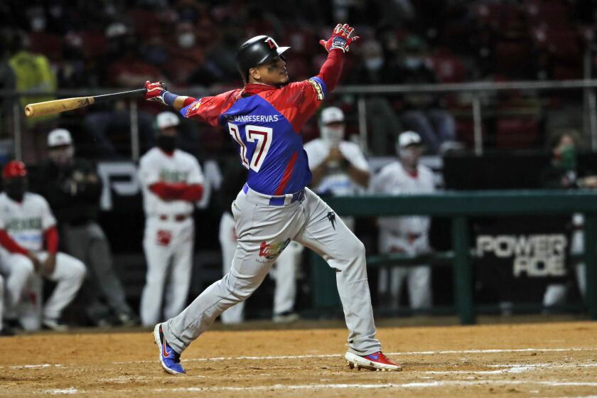 The Dominican Republic's Juan Lagares hits a home run against Mexico in a Caribbean Series game Feb. 1, 2021.