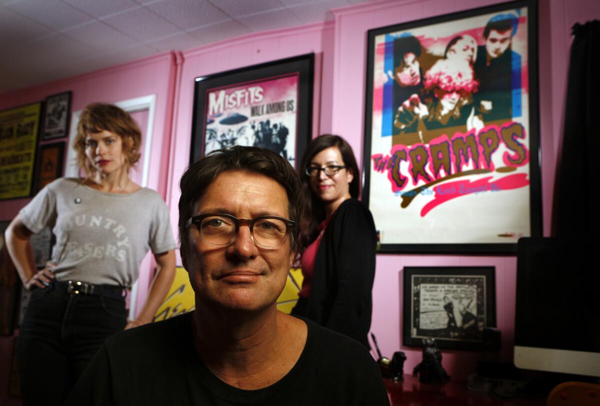 Larry Hardy, the founder of Los Angeles label In the Red, is photographed with his label manager, the artist Denee Petracek, left, and wife Robyn Ginsburg, inside his home offices.