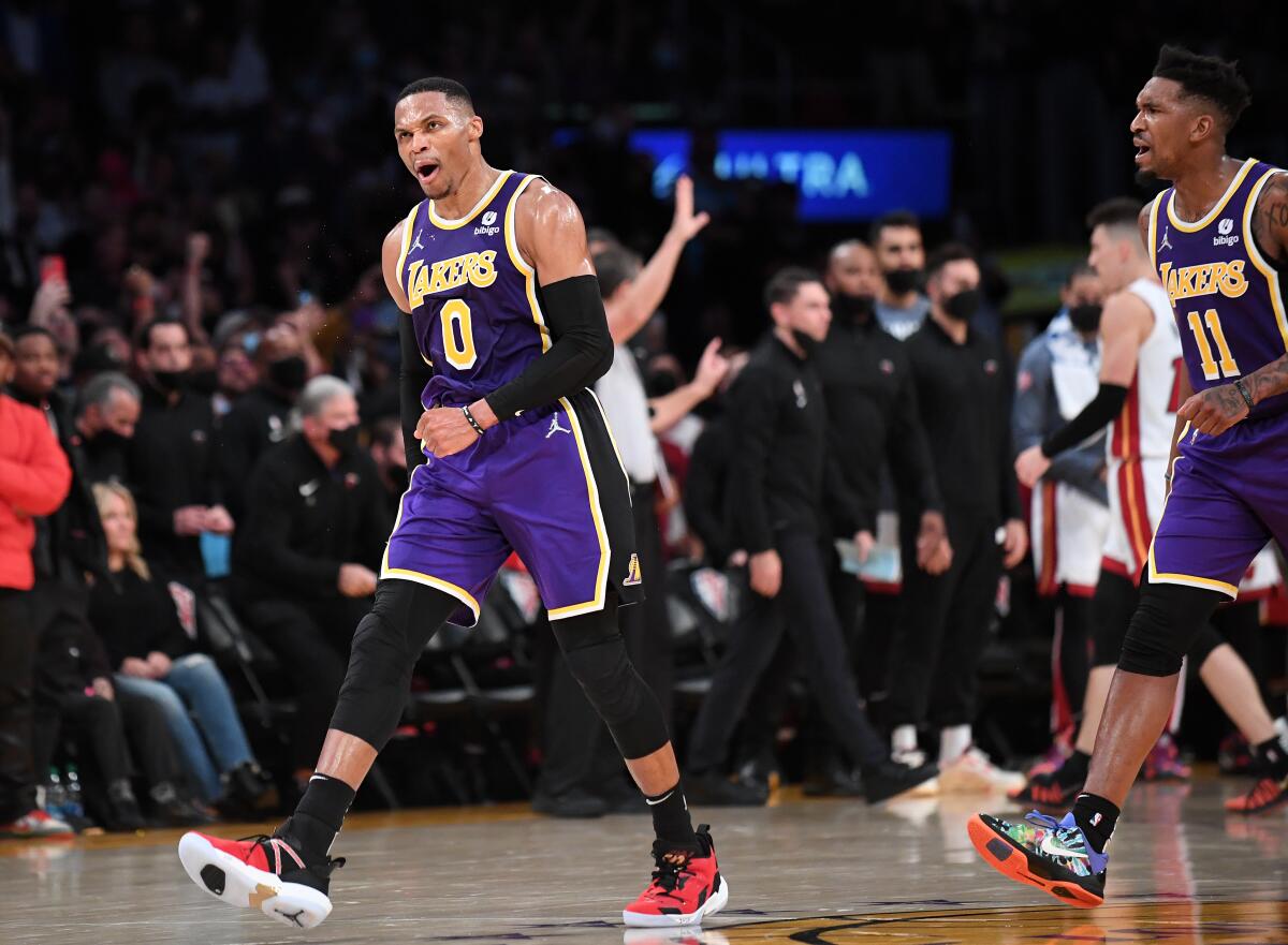 Laker Russell Westbrook celebrates his basket against the Heat late in the fourth quarter