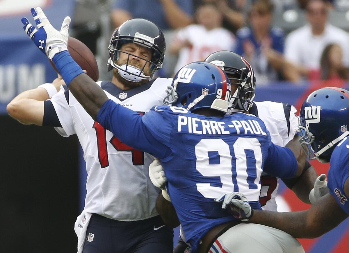 Ryan Fitzpatrick throws under pressure from New York Giants defensive end Jason Pierre-Paul in September.