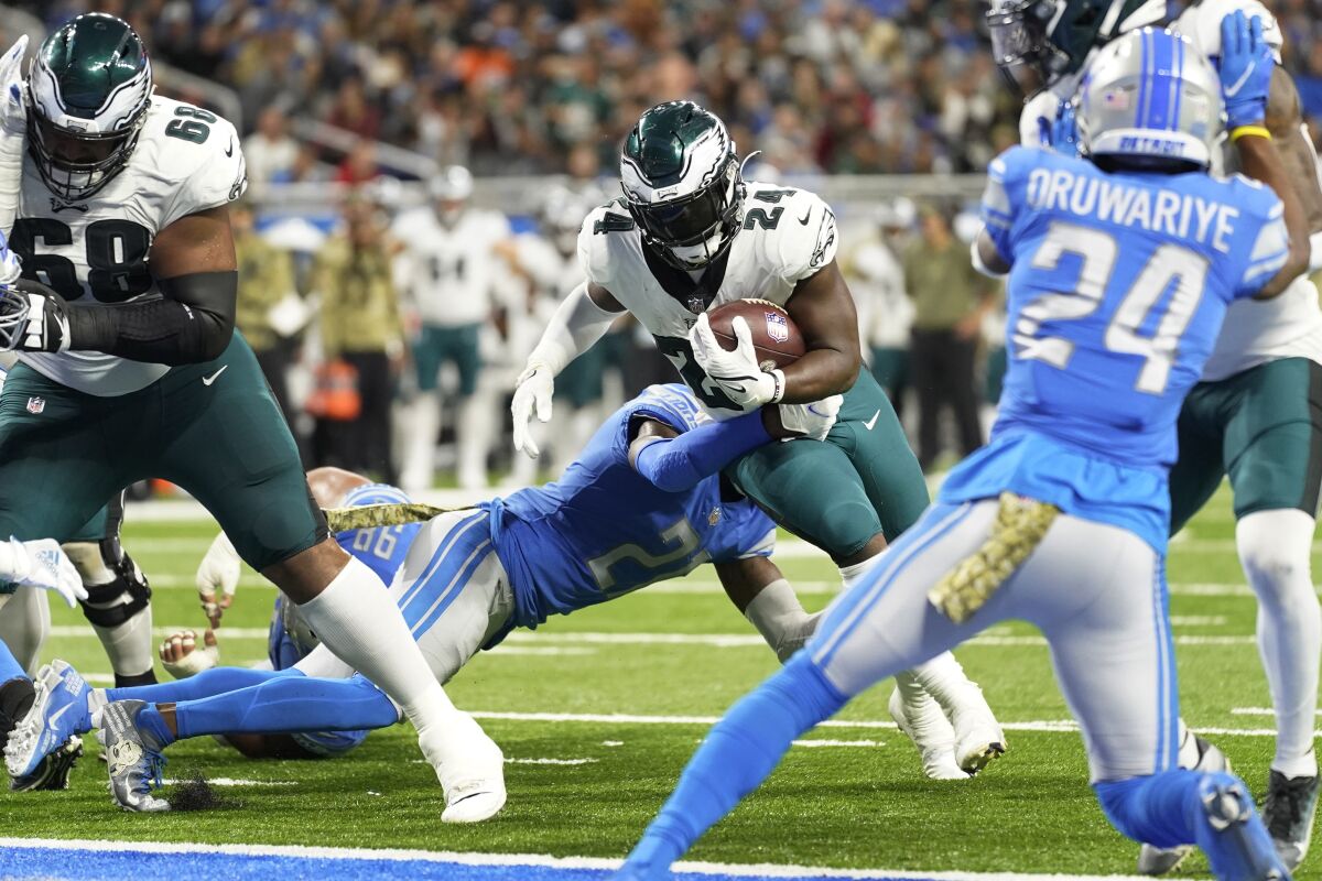Philadelphia Eagles running back Jordan Howard (24) rushes for a 2-yard touchdown during the second half of an NFL football game against the Detroit Lions, Sunday, Oct. 31, 2021, in Detroit. (AP Photo/Paul Sancya)