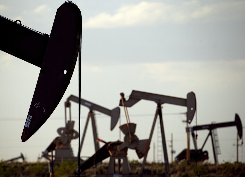 FILE - In this April 24, 2015, file photo, pumpjacks work in a field near Lovington, N.M. The Biden administration has approved thousands of drilling permits since taking office despite a campaign pledge to end fracking on federal land. (AP Photo/Charlie Riedel, File)