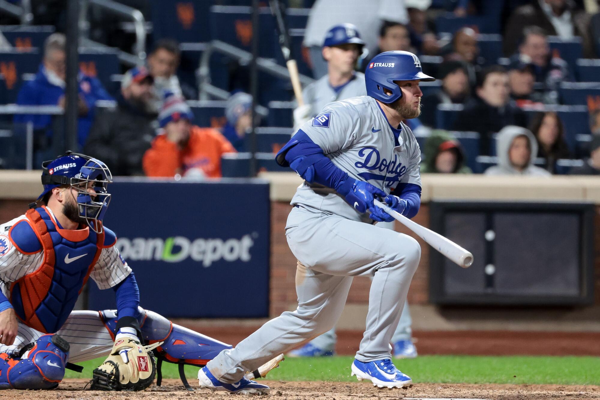 Plaschke: Executed deal! Dodgers are a lock to complete off Mets and advance to World Collection 1 Max Muncy hits a single during the seventh inning against the Mets in Game 4 of the NLCS.