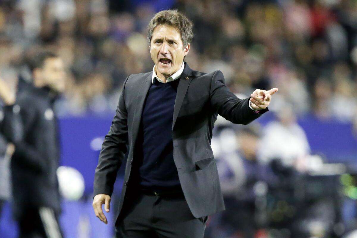 Galaxy coach Guillermo Barros Schelotto reacts to a call on the sideline during a match.