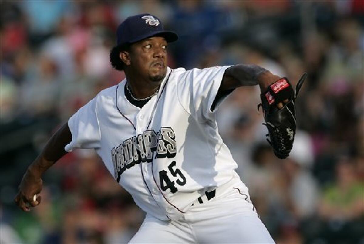 Boston Red Sox starting pitcher Pedro Martinez delivers a pitch