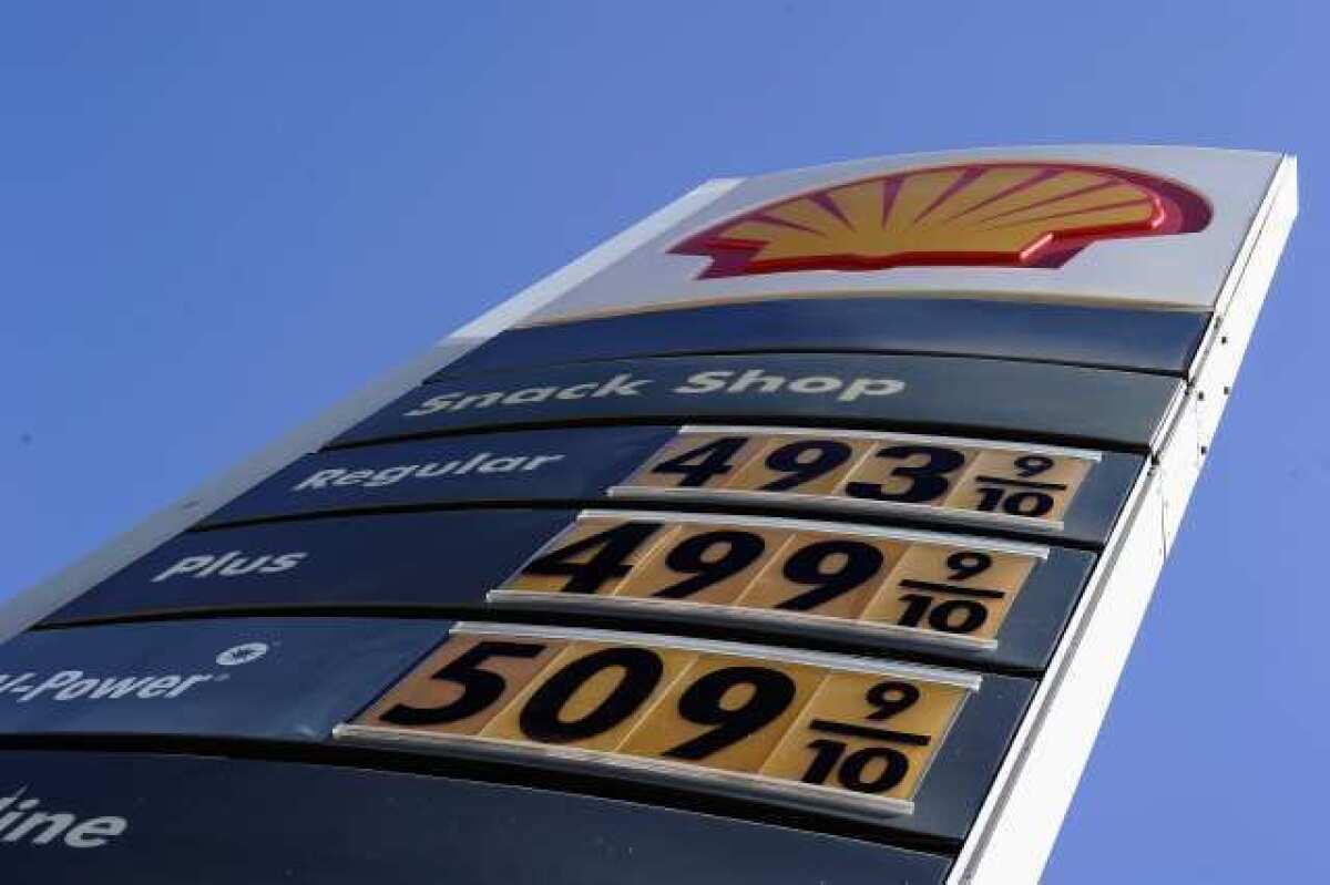 Gas prices clustered at the $5 mark are posted at a Shell station on Olympic Boulevard on Feb. 23 in Los Angeles.