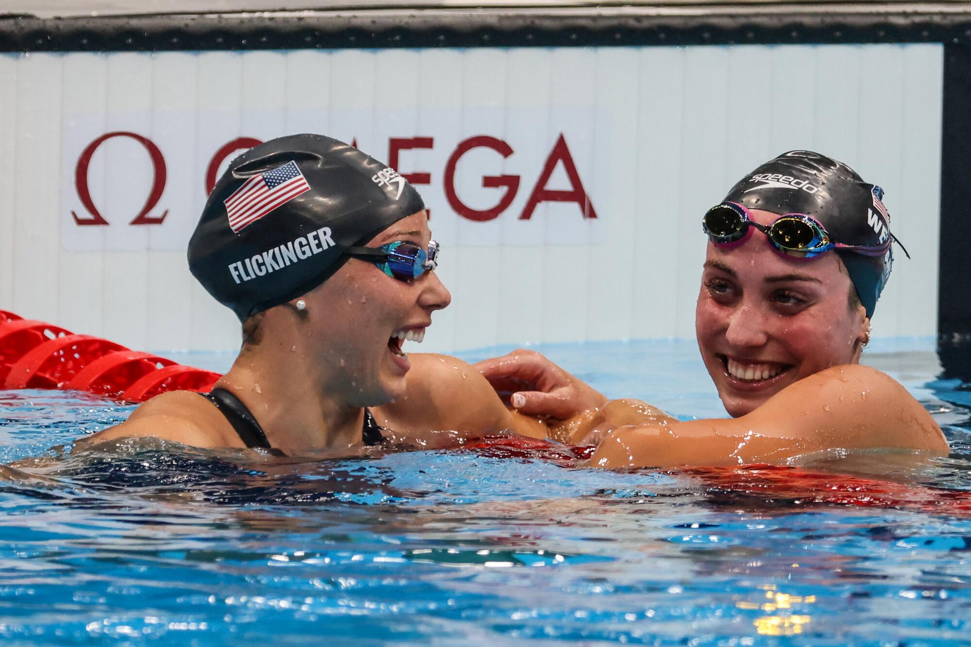USA swimmers Hali Flickinger, left, and Emma Weyant celebrate together.