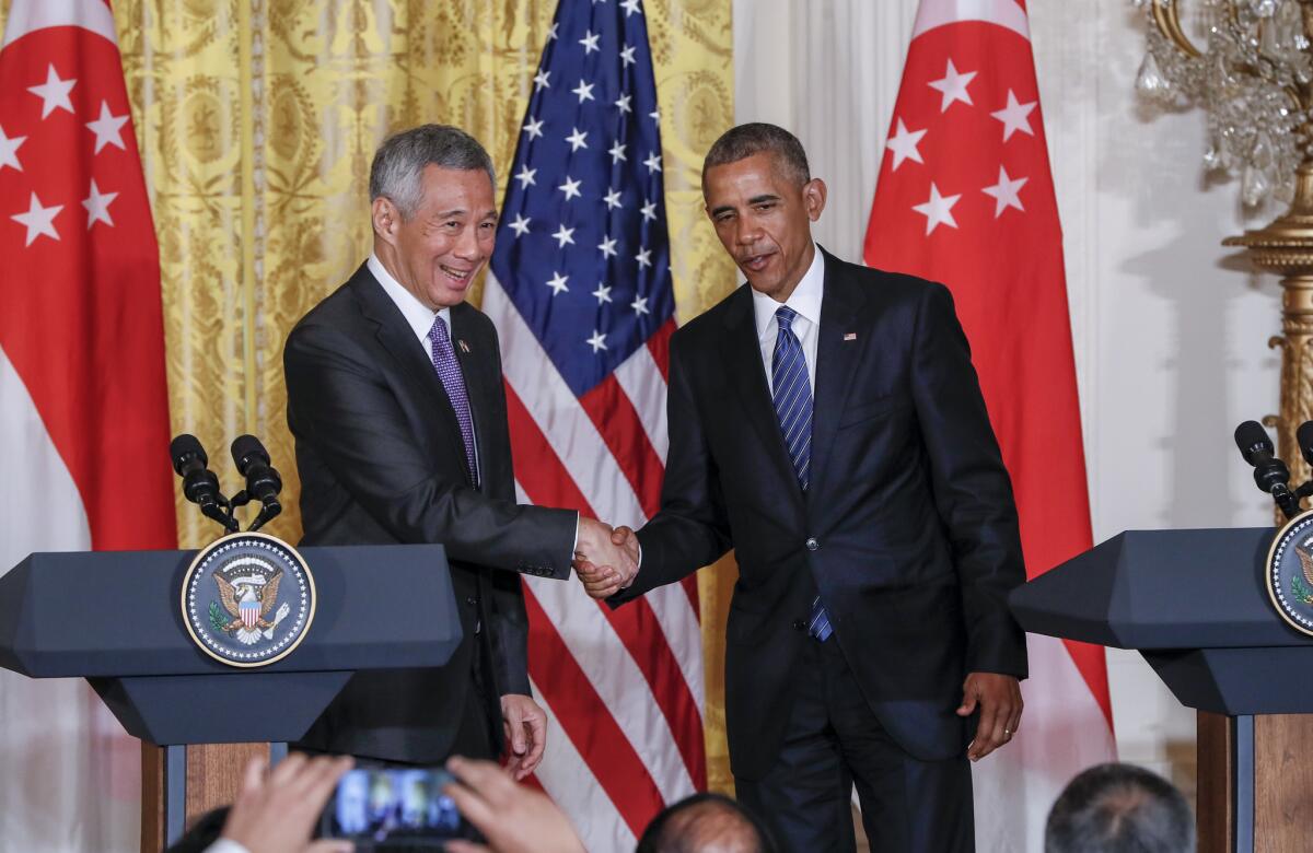 President Obama shakes hands with Singapore's Prime Minister Lee Hsien Loong at the conclusion of a joint news conference at the White House on Aug. 2.