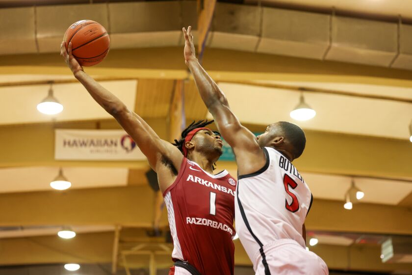 LAHAINA, HI - NOVEMBER 23: Ricky Council IV #1 of the Arkansas Razorbacks shoots over Lamont Butler #5 of the San Diego State Aztecs in the first half of the game during the Maui Invitational at Lahaina Civic Center on November 23, 2022 in Lahaina, Hawaii. (Photo by Darryl Oumi/Getty Images)