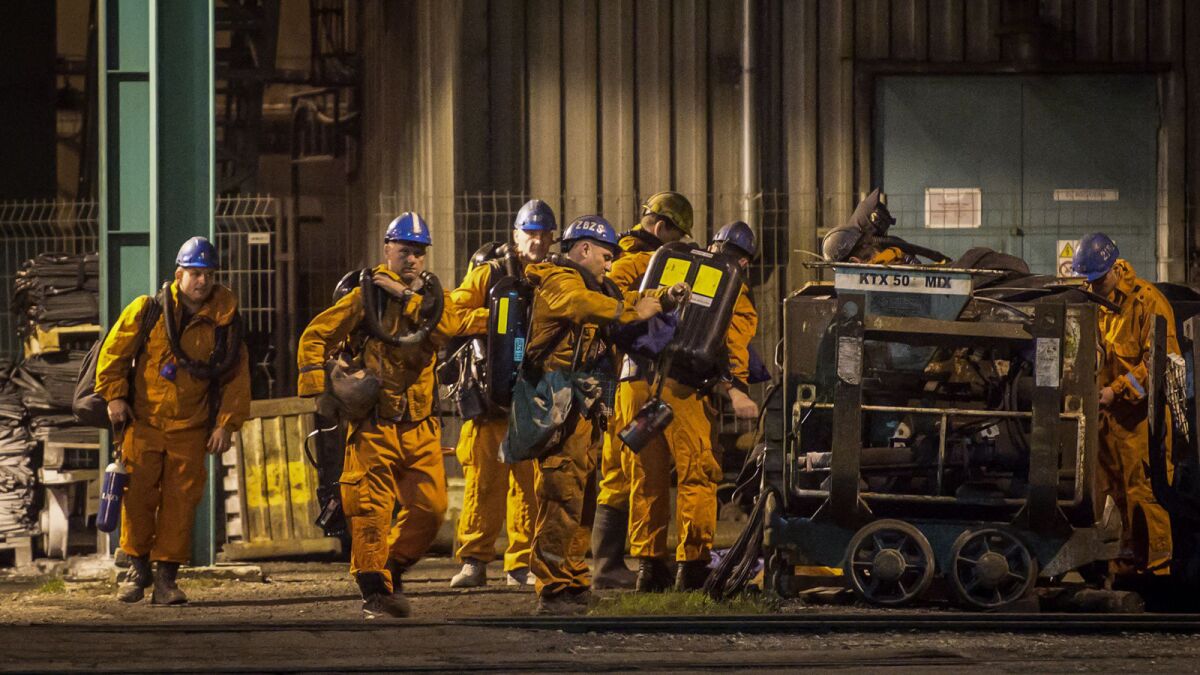 Rescue workers prepare their equipment at the CSM coal mine near in Karvina, Czech Republic, on Dec. 20.