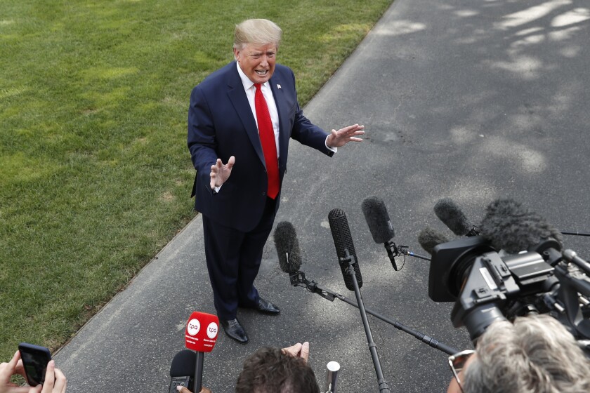 President Trump speaks to reporters outside the White House on July 24.