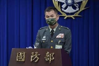In this photo released by the Taiwan Ministry of National Defense, Major general Huang Wen-chi, the assistant deputy chief of general staff for intelligence speaks during a press conference in Taipei, Taiwan, Tuesday, Feb. 14, 2023. Amid speculation over alleged Chinese spy balloons, Taiwan's Defense Ministry said Tuesday it would shoot down any suspected military object coming close to its shores from mainland China. (Taiwan Ministry of National Defense via AP)