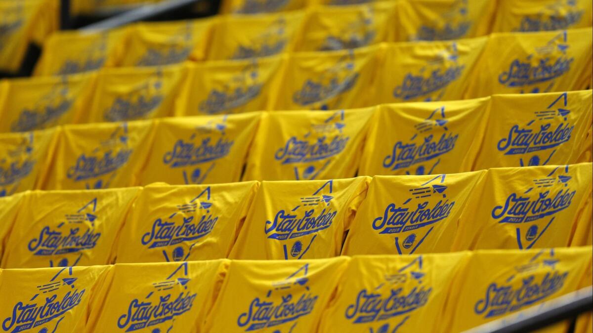"Stay Golden" T-shirts were waiting for fans at Oracle Arena for Game 3 and 4 of the NBA Finals this week.