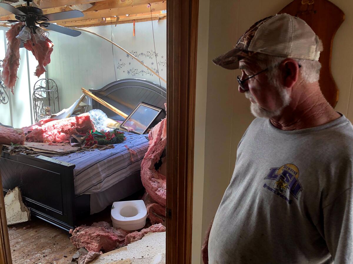 Glen Lavergne, 67, surveys hurricane damage to his Lake Charles home. 
