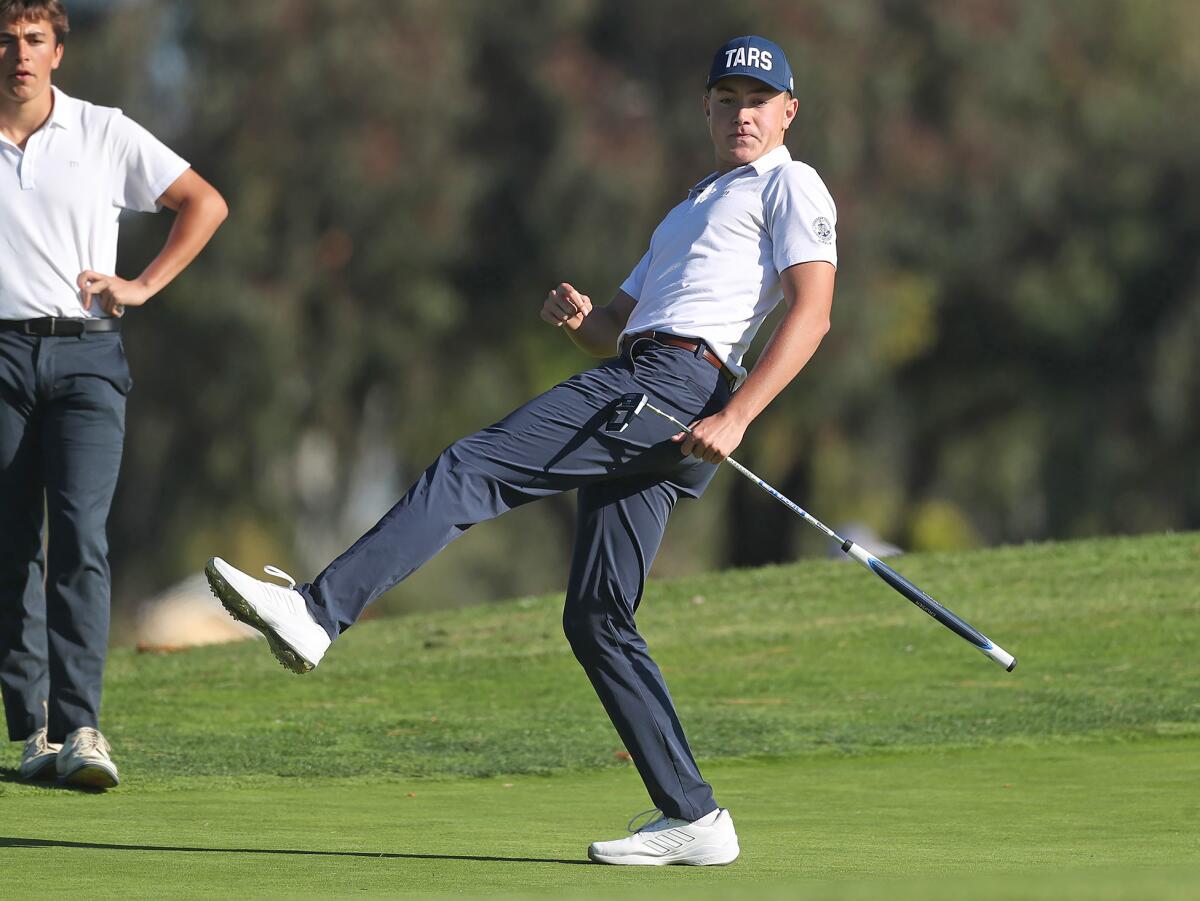 Zack Moreau of Newport Harbor wills a ball into the hole for birdie during the Battle of the Bay boys' golf match.