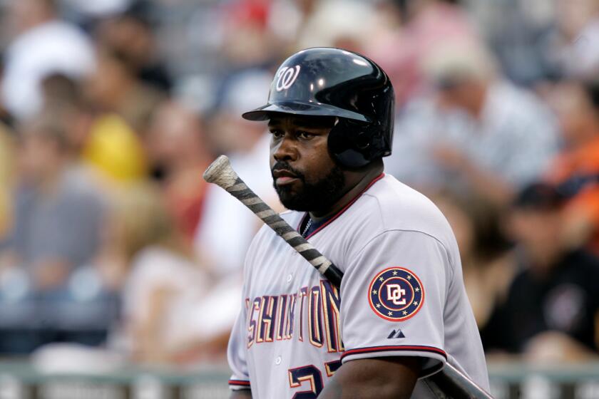 Washington Nationals' Dmitri Young warms up on deck against the Pittsburgh Pirates in a baseball game at Pittsburgh Tuesday, June 10, 2008. (AP Photo/Gene J. Puskar)